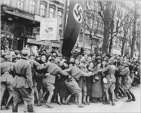 Cheering crowds greet Hitler as he enters Vienna. Austria, March 1938